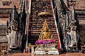 Chiang Mai - The Wat Chedi Luang. The massive chedi heavily damaged by an earthquake. The four staircases are protected by recentely restored guardian naga. 